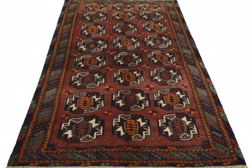 Surface texture of 2000s Baloch rug with natural Wool and intricate pattern
