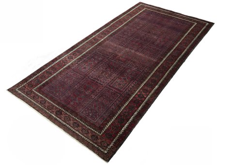 Corner detail of 2000s Baloch rug showing border pattern and Wool pile