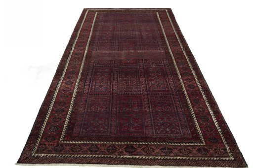 Surface texture of 2000s Baloch rug with natural Wool and intricate pattern