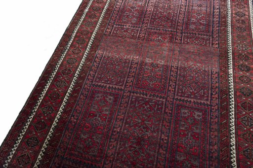 Backside of handmade 2000s Baloch rug showing knot structure and weave density
