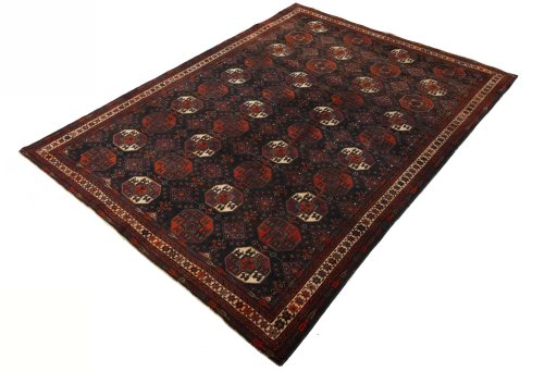 Corner detail of 2000s Baloch rug showing border pattern and Wool pile