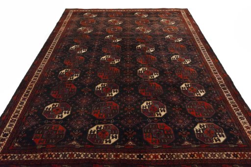 Surface texture of 2000s Baloch rug with natural Wool and intricate pattern