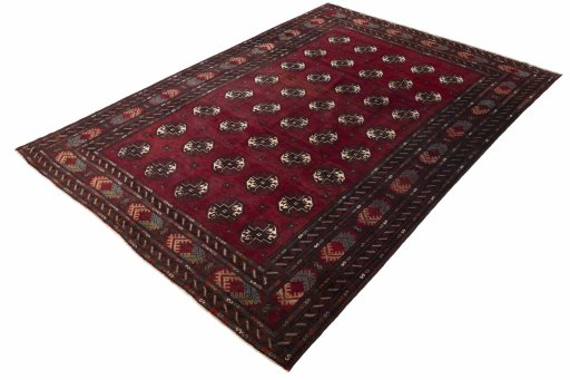 Corner detail of 2000s Baloch rug showing border pattern and Wool pile