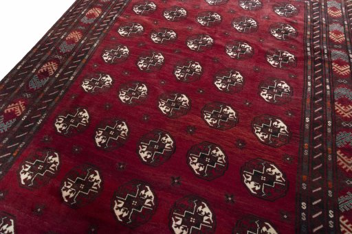 Backside of handmade 2000s Baloch rug showing knot structure and weave density