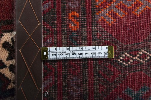 Close-up detail of 2000s Baloch rug from Iran / Persia showing Wool weave