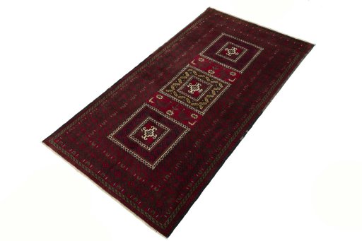 Corner detail of 2000s Baloch rug showing border pattern and Wool pile