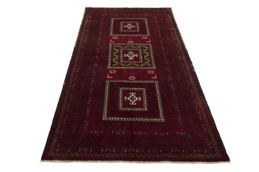 Surface texture of 2000s Baloch rug with natural Wool and intricate pattern