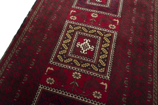 Backside of handmade 2000s Baloch rug showing knot structure and weave density
