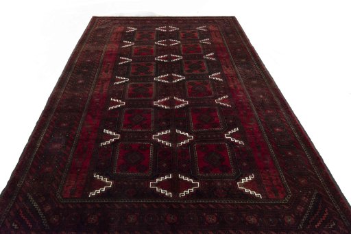 Surface texture of 2000s Baloch rug with natural Wool and intricate pattern