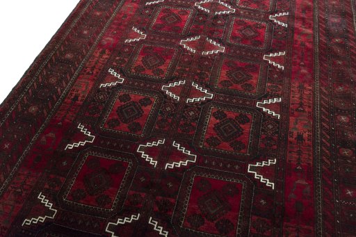 Backside of handmade 2000s Baloch rug showing knot structure and weave density