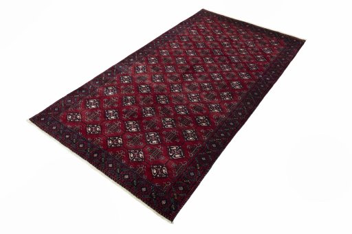 Corner detail of 2000s Baloch rug showing border pattern and Wool pile