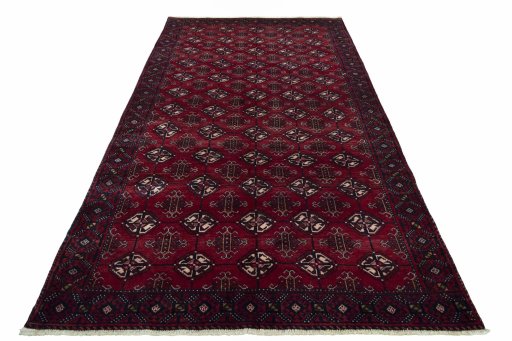 Surface texture of 2000s Baloch rug with natural Wool and intricate pattern