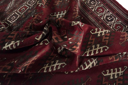 Corner detail of 1970s Baloch rug showing border pattern and Wool pile