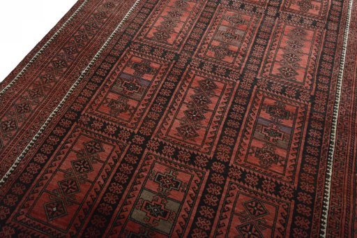 Backside of handmade 2000s Baloch rug showing knot structure and weave density
