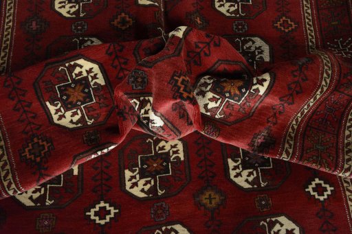 Corner detail of 2000s Baloch rug showing border pattern and Wool pile