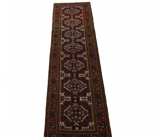 Surface texture of 2000s Baloch rug with natural Wool and intricate pattern