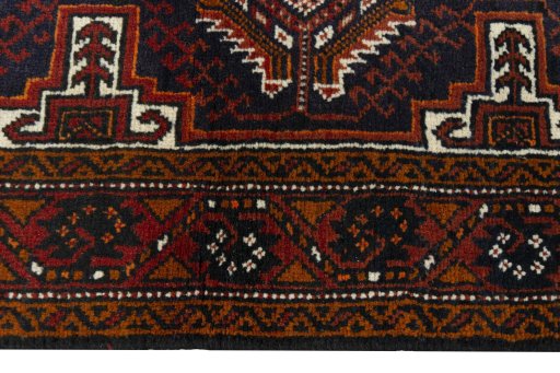 Close-up detail of 2000s Baloch rug from Iran / Persia showing Wool weave