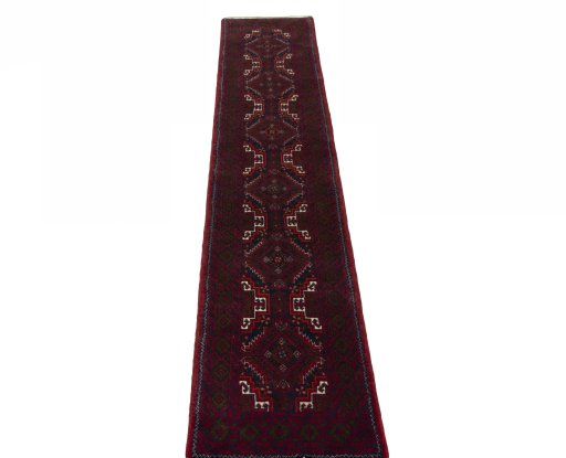 Surface texture of 2000s Baloch rug with natural Wool and intricate pattern
