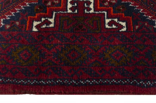 Close-up detail of 2000s Baloch rug from Iran / Persia showing Wool weave