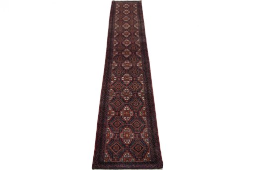 Surface texture of 2000s Baloch rug with natural Wool and intricate pattern
