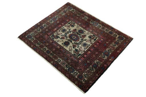 Corner detail of 2000s Baloch rug showing border pattern and Wool pile