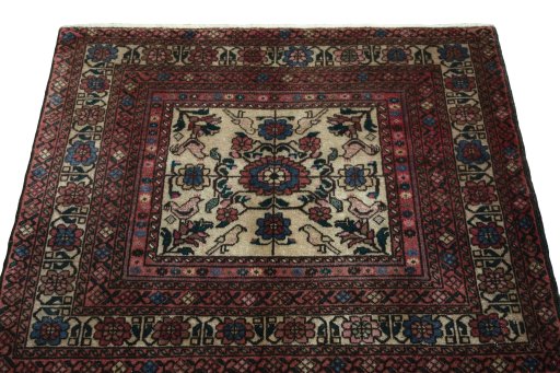 Surface texture of 2000s Baloch rug with natural Wool and intricate pattern