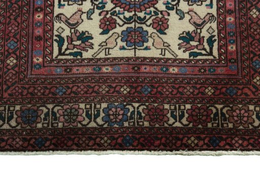 Backside of handmade 2000s Baloch rug showing knot structure and weave density