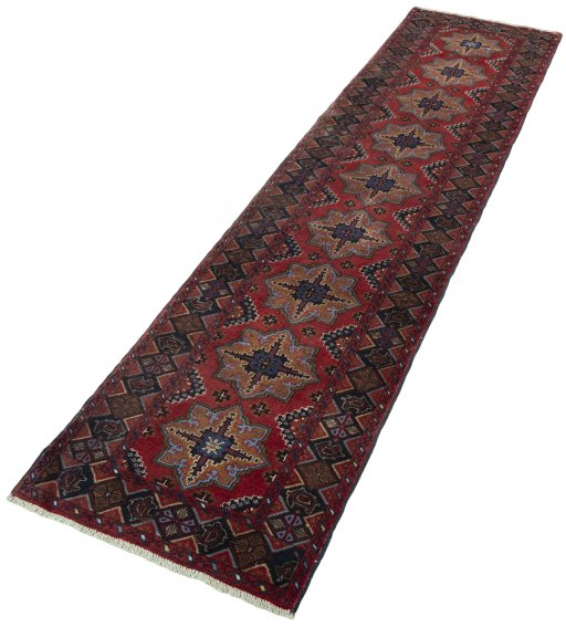 Corner detail of 2000s Baloch rug showing border pattern and Wool pile