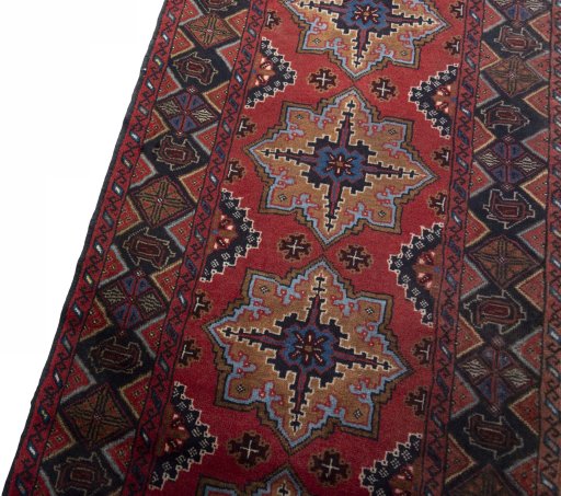 Backside of handmade 2000s Baloch rug showing knot structure and weave density