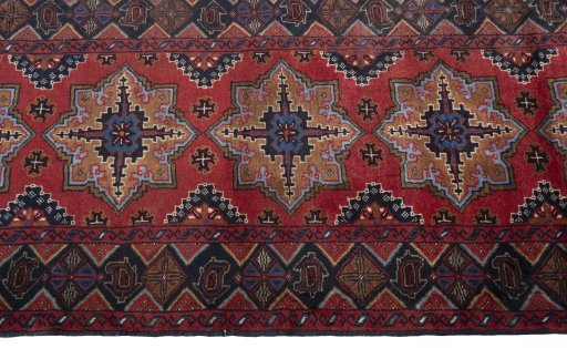 Close-up detail of 2000s Baloch rug from Iran / Persia showing Wool weave