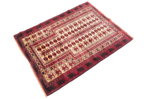 Corner detail of 1970s Baloch rug showing border pattern and Wool pile