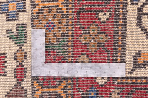 Corner detail of 1998s Baloch rug showing border pattern and Wool pile