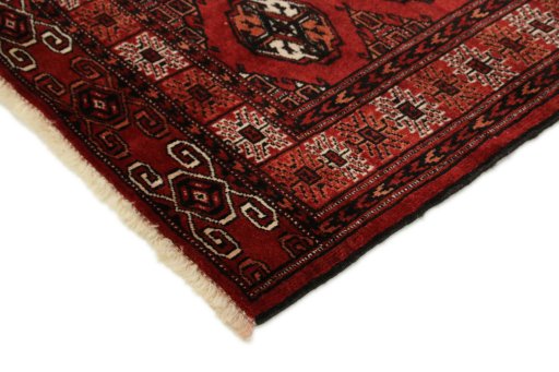 Backside of handmade New Baloch rug showing knot structure and weave density