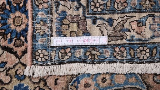 Corner detail of 1910s Dorokhsh rug showing border pattern and Wool pile