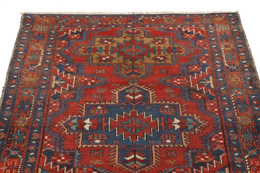 Surface texture of 1920s Gharajeh rug with natural Wool and intricate pattern