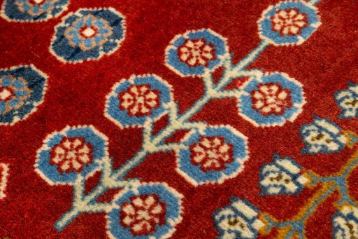 Backside of handmade New Ghashghai rug showing knot structure and weave density