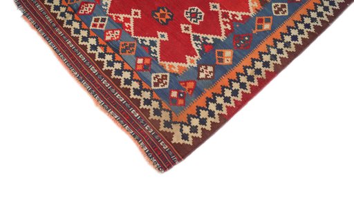 Backside of handmade 1940s Ghashghai rug showing knot structure and weave density