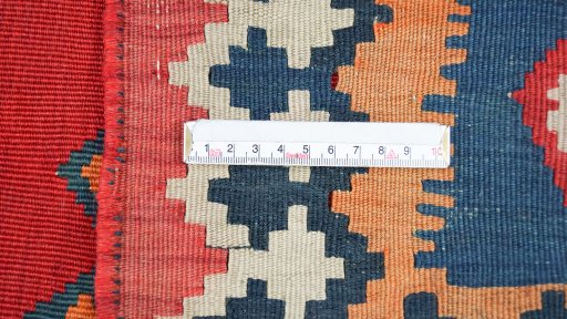 Full view of 1940s Ghashghai rug from Iran / Persia, 303 × 158 cm in Red tones