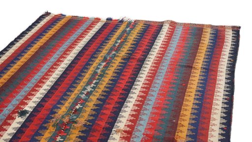 Surface texture of 1920s Ghashghai rug with natural Wool and intricate pattern