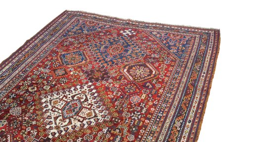 Surface texture of 1940s Ghashghai rug with natural Wool and intricate pattern