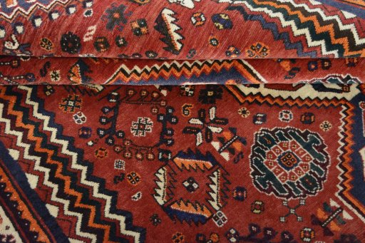 Corner detail of 2000s Ghashghai rug showing border pattern and Wool pile