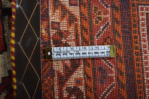 Surface texture of 2000s Ghashghai rug with natural Wool and intricate pattern