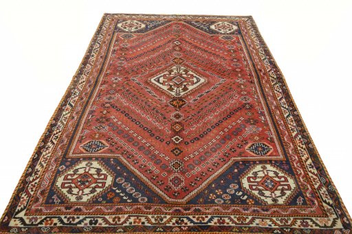 Surface texture of 2000s Ghashghai rug with natural Wool and intricate pattern