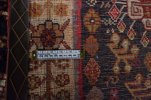 Surface texture of 2000s Ghashghai rug with natural Wool and intricate pattern