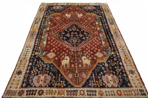 Surface texture of 2000s Ghashghai rug with natural Wool and intricate pattern