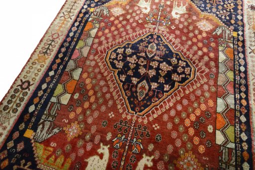 Backside of handmade 2000s Ghashghai rug showing knot structure and weave density