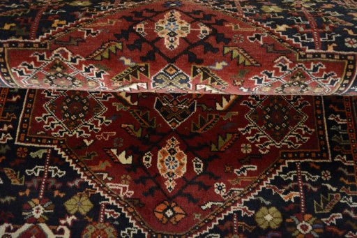 Corner detail of 2000s Ghashghai rug showing border pattern and Wool pile
