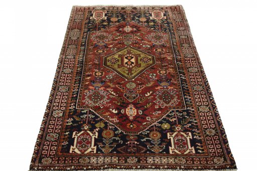 Surface texture of 2000s Ghashghai rug with natural Wool and intricate pattern