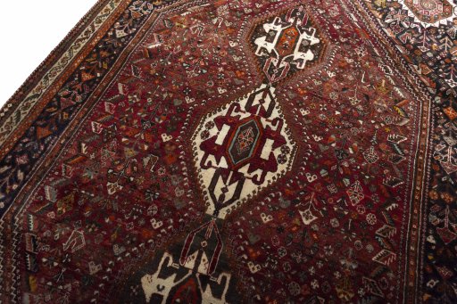 Backside of handmade 2000s Ghashghai rug showing knot structure and weave density