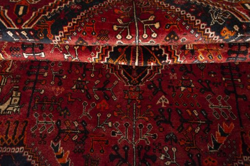 Corner detail of 2000s Ghashghai rug showing border pattern and Wool pile